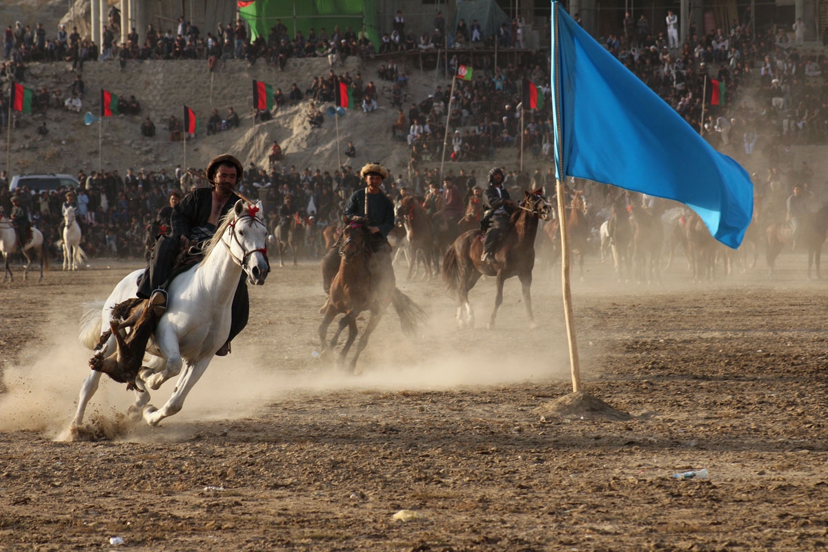 In this photograph taken on November 7, 2017 Afghan horsemen compete in the traditional sport of Buzkashi in Badakhshan province.