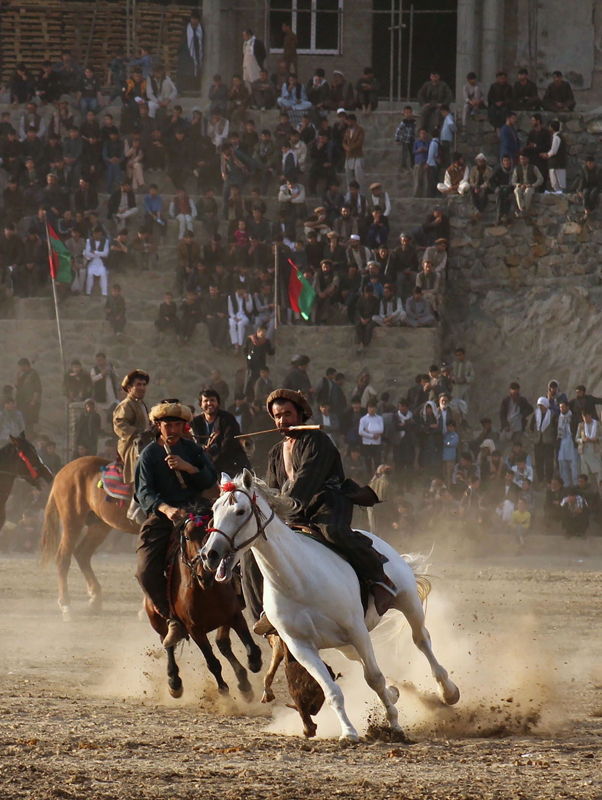 In this photograph taken on November 7, 2017 Afghan horsemen compete in the traditional sport of Buzkashi in Badakhshan province.