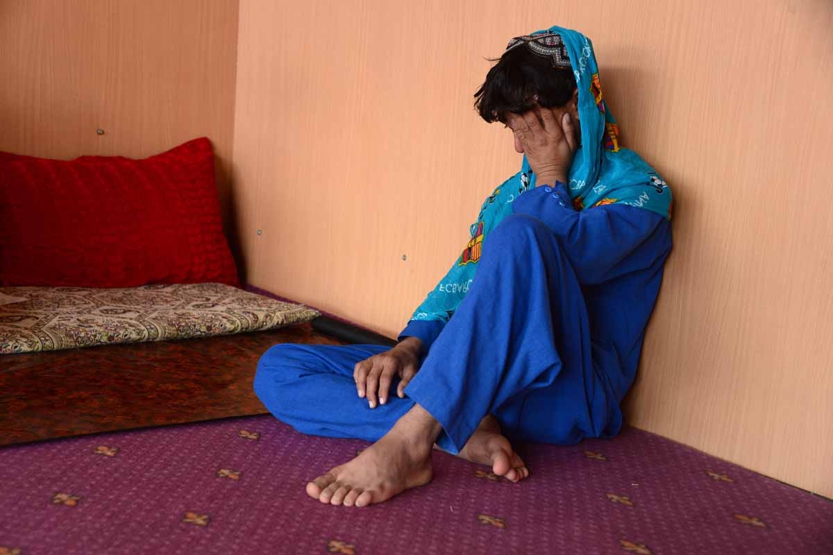 This file photo taken on October 31, 2016 shows an Afghan boy, who was held as a child sex slave, sitting at a restaurant in a unidentified location in Afghanistan.