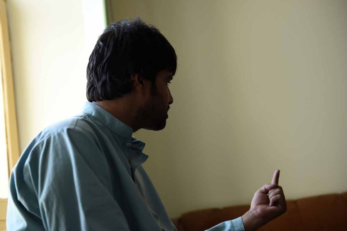 This file photo taken on October 5, 2016 shows Shirin, the brother-in-law of a bacha bazi victim, a teenage boy, gesturing as he talks during an interview with AFP in Lashkar Gah of Helmand province.