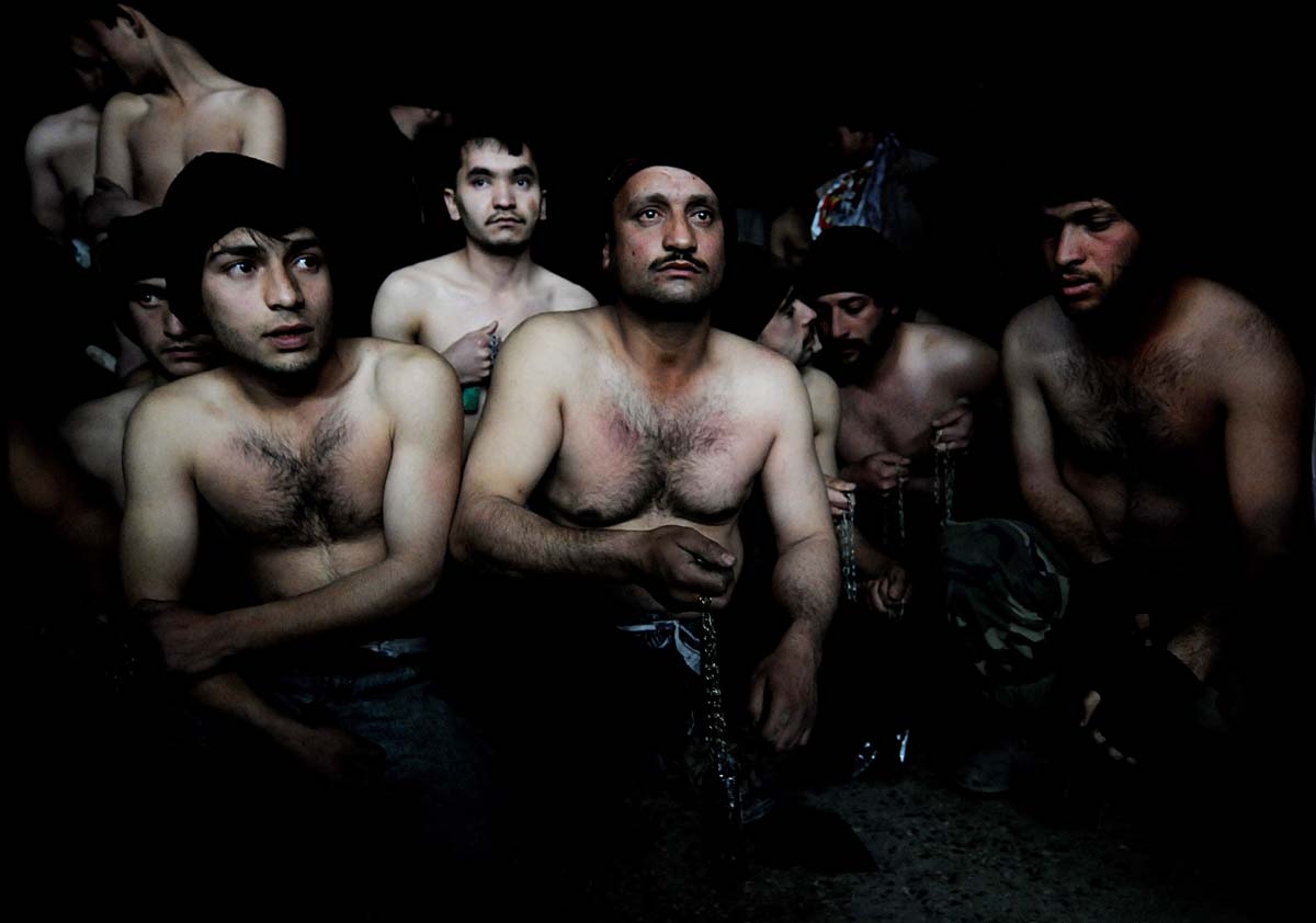 (FILES) In this file photo taken on January 15, 2008 Afghan men hold chains as they wait to take part in ritual self-flagellation to celebrate the Muslim festival of Ashura, at a mosque in Kabul.