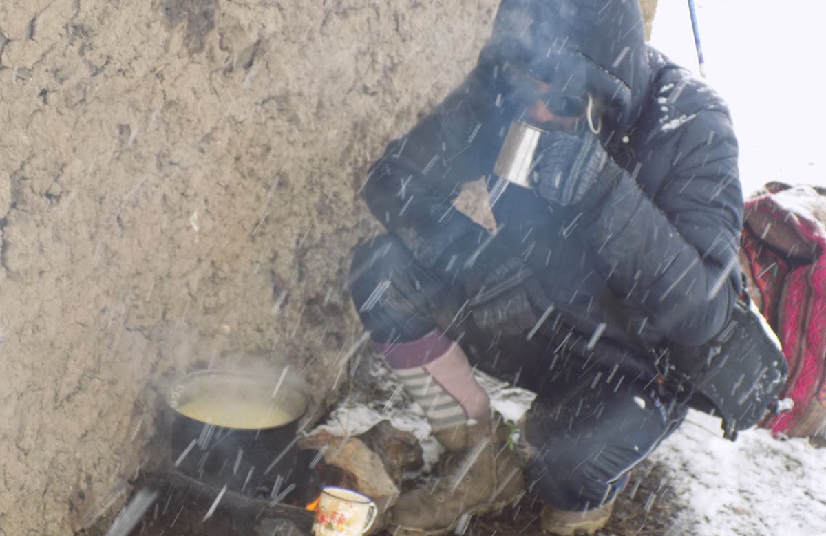 The author trying to keep warm with hot noodles.