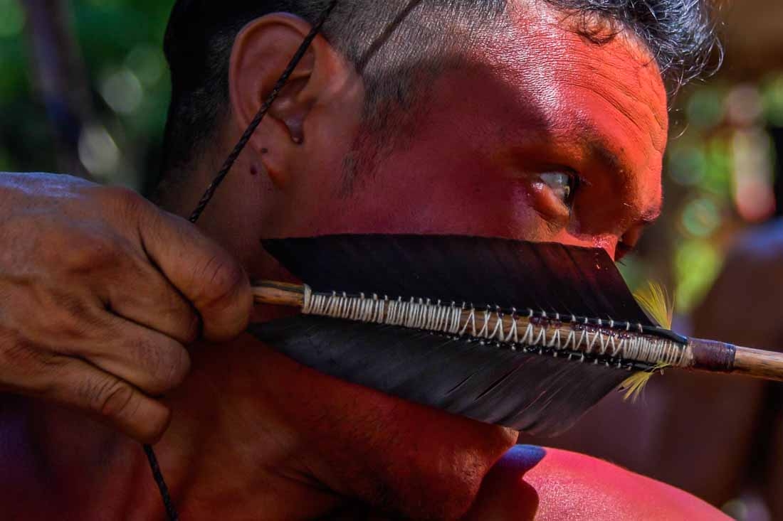 A Waiapi man uses his bow and arrow at the Pinoty village at the Waiapi indigenous reserve on Amapa state, in Brazil, on October 12, 2017.