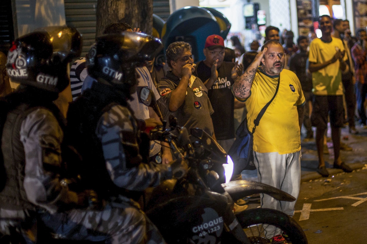 Supporters of far-right presidential candidate Jair Bolsonaro, celebrate after the former army captain won Brazil's presidential election, in Rio de Janeiro, Brazil, on October 28, 2018. - 