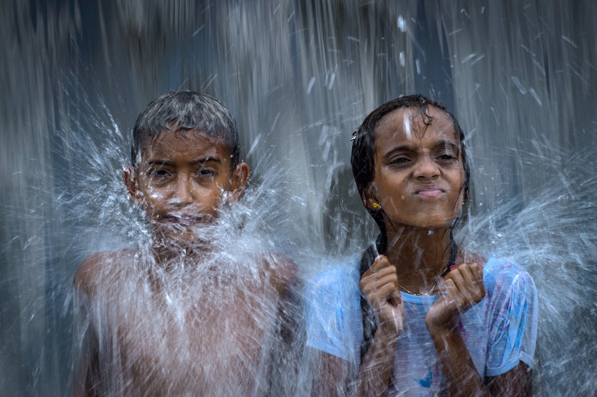 Children play with water at the Madureira park in Rio de Janeiro, Brazil, on January 25, 2015.