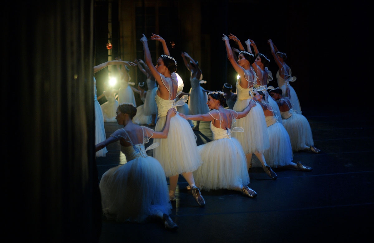Ballet dancers perform during a rehearsal before the opening night of a Ballet production at the Municipal Theater in Rio de Janeiro, Brazil on June 21, 2018. -