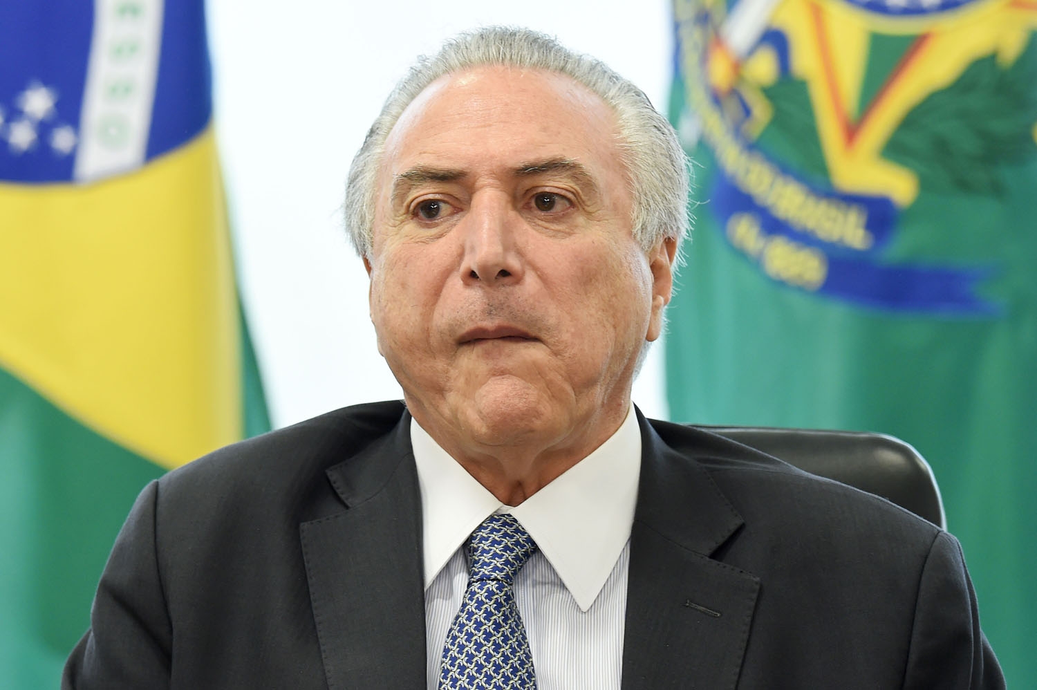 Brazilian acting President Michel Temer speaks during a meeting with leaders of allied parties in the Lower House at the Planalto Palace in Brasilia on May 17, 2016 Brazilian acting President Michel Temer speaks during a meeting with leaders of allied parties in the Lower House at the Planalto Palace in Brasilia on May 17, 2016