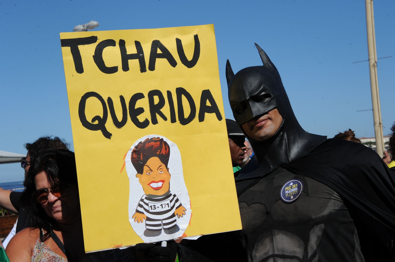 A man disguised as Batman holds a sign reading Bye Darling during a protest in favor of impeachment of President Dilma Rousseff in Copacabana, Rio de Janeiro, Brazil on April 17, 2016. A man disguised as Batman holds a sign reading Bye Darling during a protest in favor of impeachment of President Dilma Rousseff in Copacabana, Rio de Janeiro, Brazil on April 17, 2016.