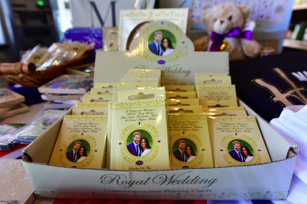 Decks of playing cards are displayed among a selection of royal wedding merchandise at Ye Olde Kings Head gift shop in Santa Monica, California on May 14, 2018, where royal wedding merchandise with pictures of Prince Harry and Meghan Markle have been sell