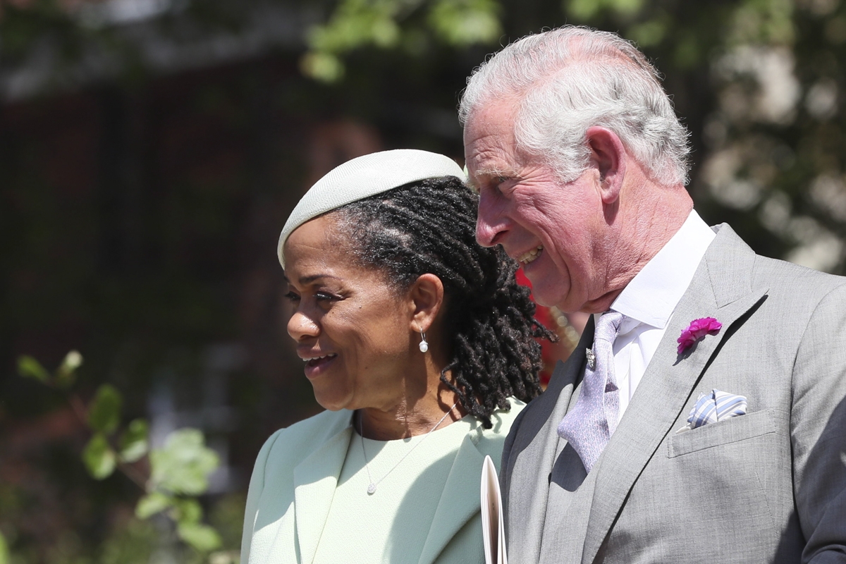 Meghan Markle's mother Doria Ragland (L) and Prince Harry's father Britain's Prince Charles, Prince of Wales (R) leave after attending the wedding ceremony of Britain's Prince Harry, Duke of Sussex and US actress Meghan Markle at St George's Chapel, Winds
