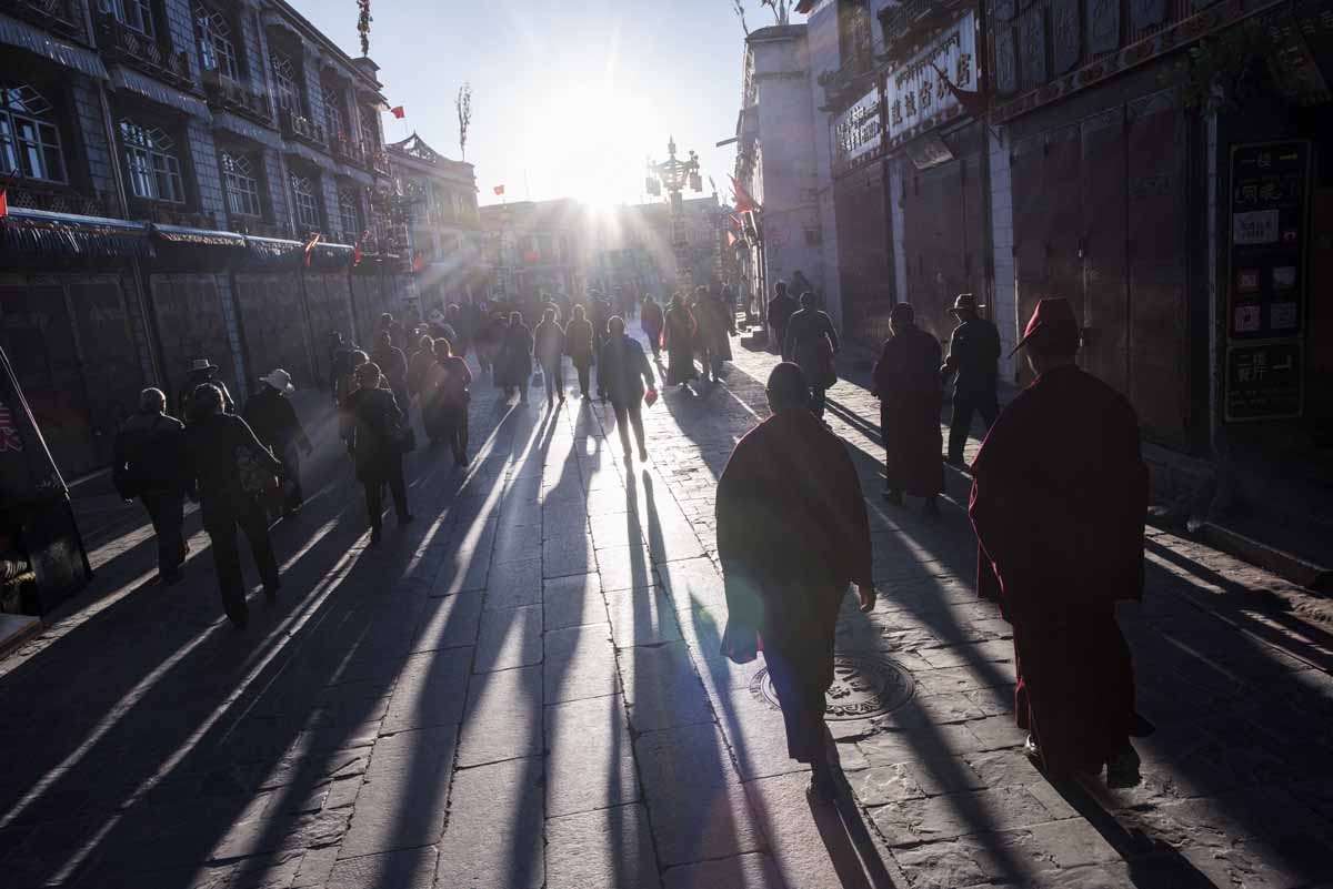 This picture taken on September 10, 2016 shows pilgrims praying and prostrating outside the Jokhang Temple in the regional capital Lhasa, in China's Tibet Autonomous Region. This picture taken on September 10, 2016 shows pilgrims praying and prostrating outside the Jokhang Temple in the regional capital Lhasa, in China's Tibet Autonomous Region.