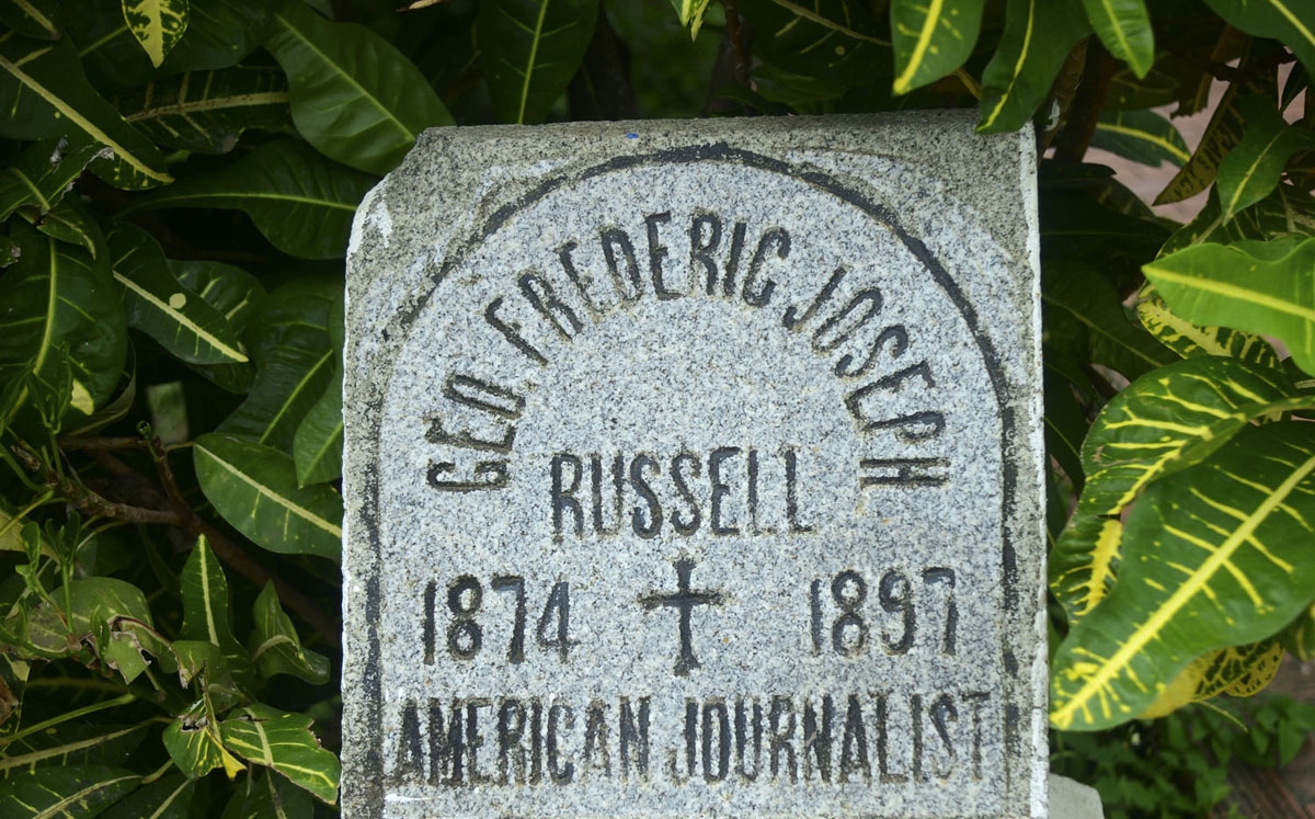 View of the tombstone of US journalist Frederic Joseph Russell at Nuestra Senora del Carmen cemetery in Turbo municipality, Antioquia department, Colombia, on June 15, 2016