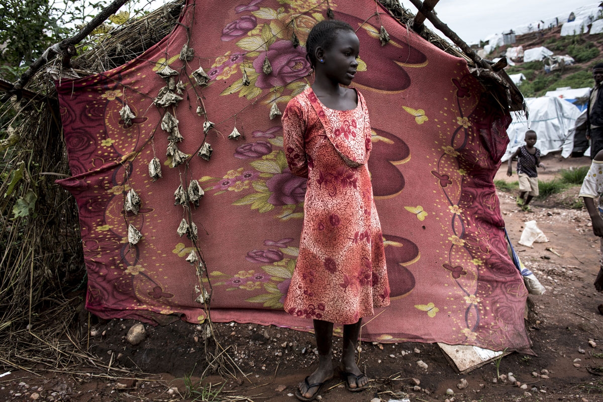 A young Congolese girl stands inside a camp for Internally Displaced Persons (IDP) on March 20, 2018 in Kalemie, Democratic Republic of the Congo.