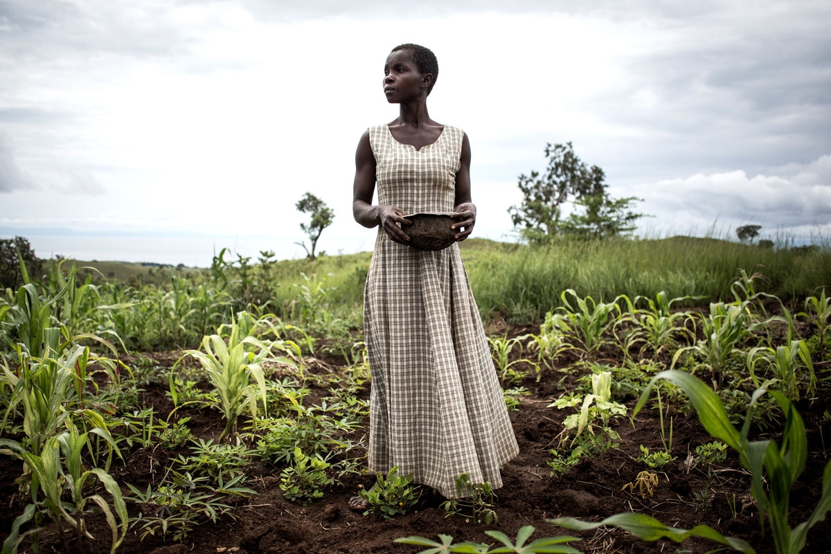 Martha, who has been displaced with her husband and five children for six months, plants seeds in a makeshift camp for Internally Displaced Persons (IDP's) and returnees on March 21, 2018 in the village of Kabutunga, in the Tanganyika region in Democratic