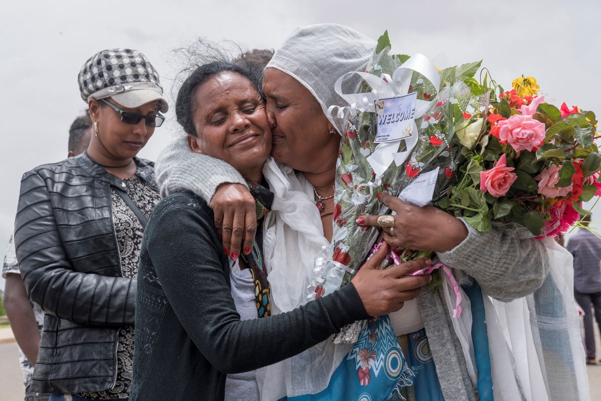 Fana Tesfatsion (R) hugs her sister Alem as she meets her for the first time since five years at Asmara International airport on July 21, 2018. Fana, an Ethiopian living in Ethiopia, couldnt get to her fathers funeral five years ago in Eritrea.