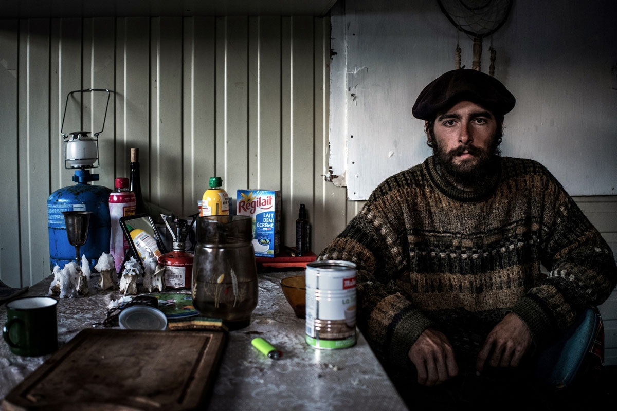 French shepherd Gaetan Meme, 24-years-old, poses in his altitude hut at the end of the season of pastures, on October 13, 2018, in the mountains near the Col du Glandon, in the French Alps. - Gaetan shepherds a flock of 1,300 sheep in the Alpine pastures