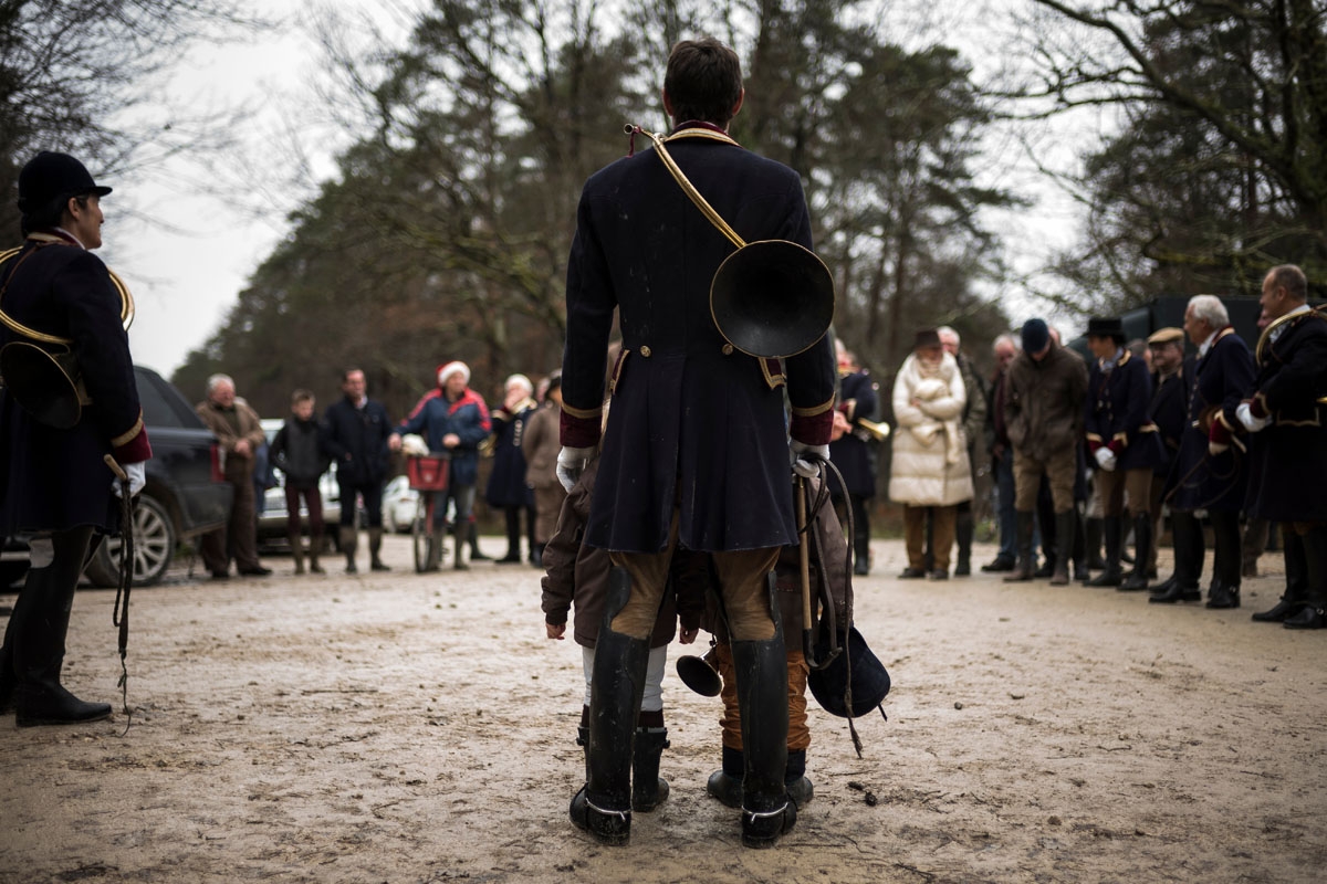 Huntsman Philippe Prioux, from the Rallye Tempete is pictured during a brieffing before the hunt during a hunting with hounds on December 23, 2017 in the forest near Chatenoy, center France.