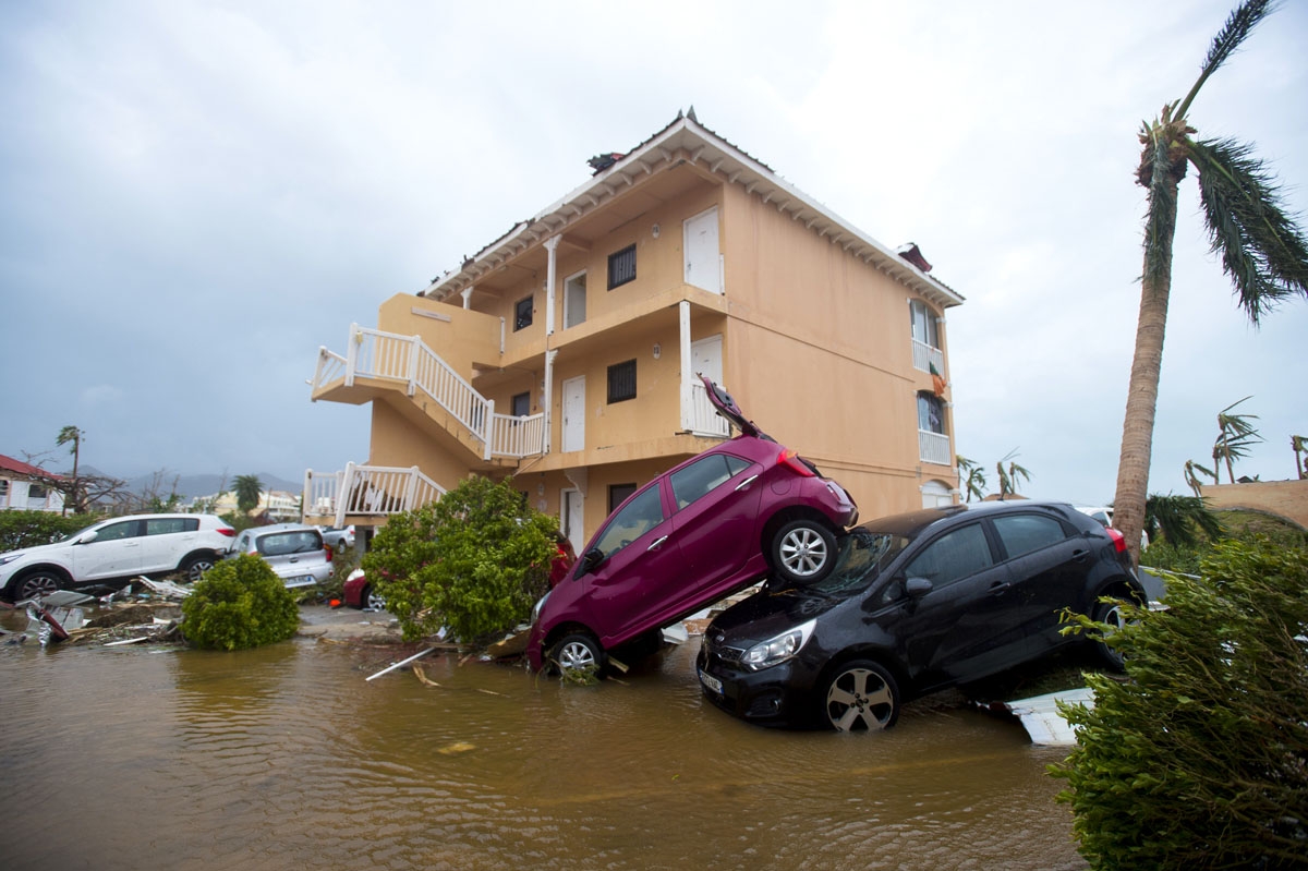 A photo taken on September 6, 2017 shows cars piled on top of one another in Marigot, near the Bay of Nettle, on the French Collectivity of Saint Martin, after the passage of Hurricane Irma.