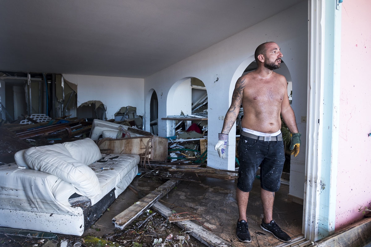 A man reacts as stands in his destroyed home on September 7, 2017 in Orient Bay on the French Carribean island of Saint-Martin, after the passage of Hurricane Irma.