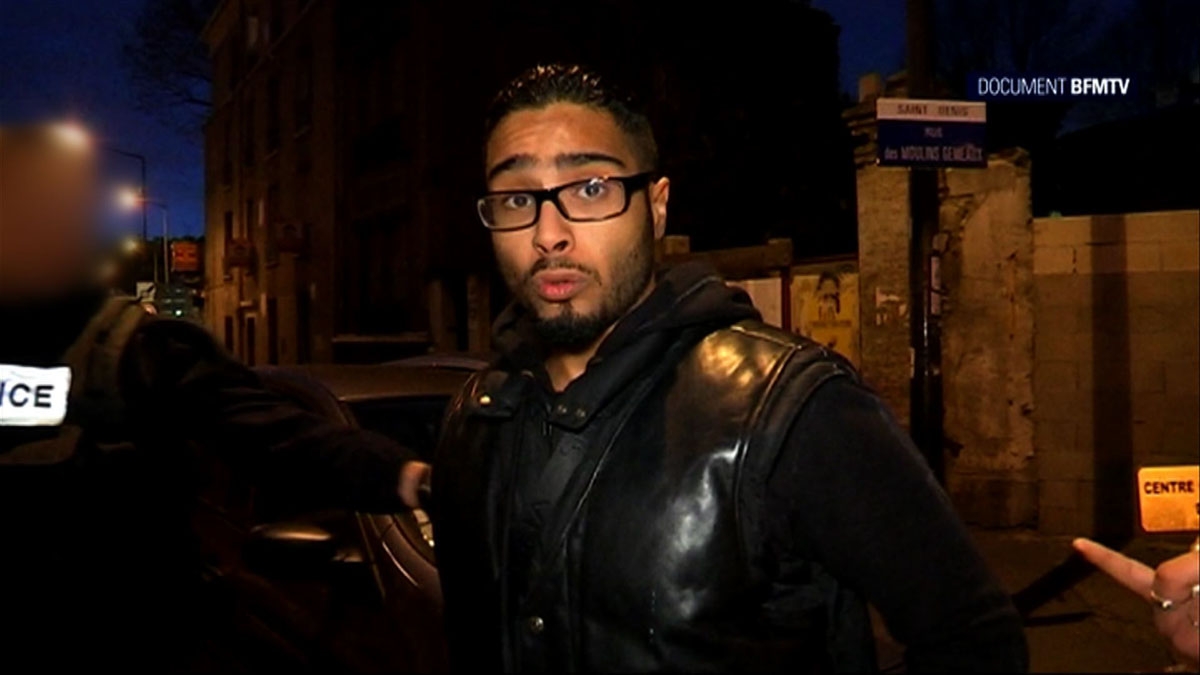 A image grab made from a handout video taken on November 18, 2015 and released on November 25, 2015 by BFMTV shows Jawad Bendaoud, the man who allegedly lent his Paris suburb apartment to the suspected ringleader of the attacks on Paris, being arrested in