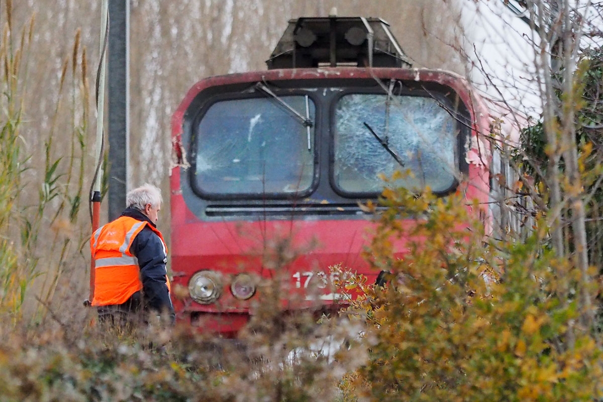 A SNCF worker inspects the front of a regional TER train that crashed into a school bus in Millas, near Perpignan, southern France, on December 15, 2017, a day after the accident at a level crossing.