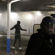 A man gestures in front of the anti riot police in Bobigny, northern Paris, on February 16, 2017 during a demonstration to demand justice for Theo, a 22-year-old youth worker who required surgery after his arrest last week in the gritty suburb of Aulnay-s