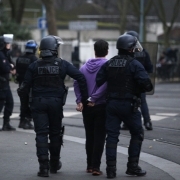 . Anti-riot police officers detain a young man in the northern Pqris suburb of Bobigny on February 16, 2017 during scuffles within a demonstration to demand justice for Theo, a 22-year-old youth worker who was allegedly assaulted by Police in Aulnay-sous-