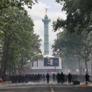 French CRS anti-riot police officers walk towards the Bastille square during a march for the annual May Day workers' rally in Paris on May 1, 2017.