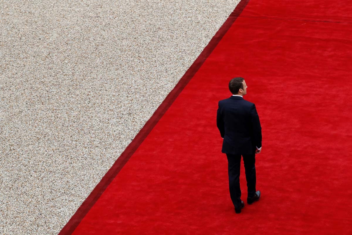 French newly elected President Emmanuel Macron is welcomed by his predecessor as he arrives at the Elysee presidential Palace for the handover and inauguration ceremonies