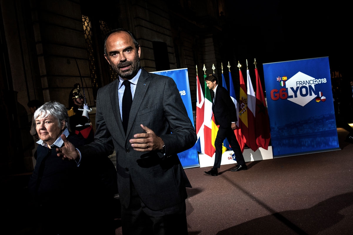 French prime minister and interim interior minister Edouard Philippe (R) and French Minister attached to the Interior Minister Jacqueline Gourault arrive for a press conference on October 8, 2018 in Lyon, during the G6 Summit of Interior Ministers of Fran