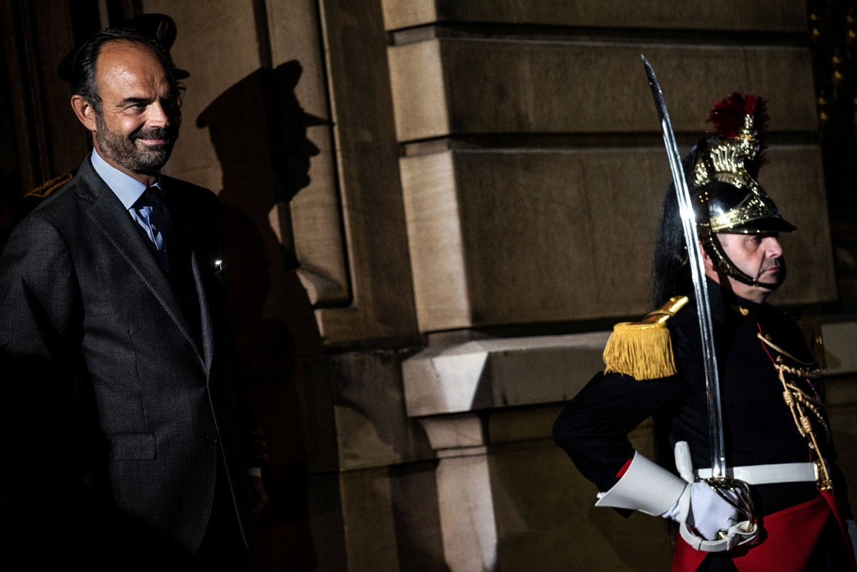 French prime minister and interim interior minister Edouard Philippe (L) waits for G6 ministers arrival on October 8, 2018 in Lyon, during the G6 Summit of Interior Ministers of France, Germany, United Kingdom, Spain, Italy and Poland. - Interior ministe