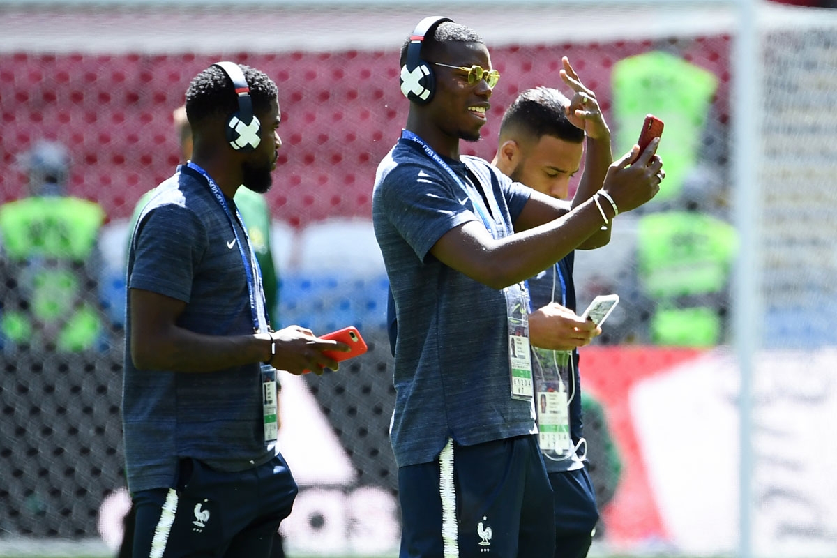(L-R) France's defender Samuel Umtiti, France's midfielder Paul Pogba and France's midfielder Corentin Tolisso check the pitch before the Russia 2018 World Cup Group C football match between France and Australia at the Kazan Arena in Kazan on June 16, 201