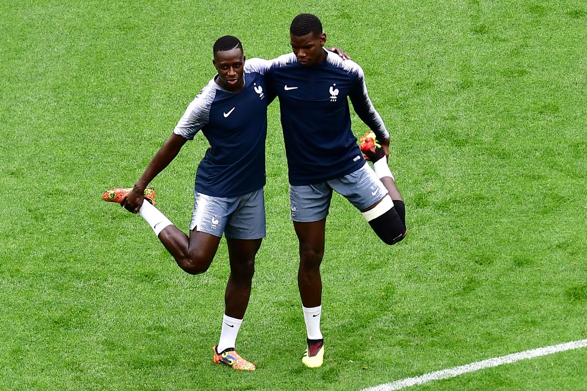 France's defender Benjamin Mendy (L) and France's midfielder Paul Pogba (R) take part in a training session of France's national football team at the Saint Petersburg Stadium, in Saint Petersburg, on July 9, 2018, on the eve of their Russia 2018 World Cup
