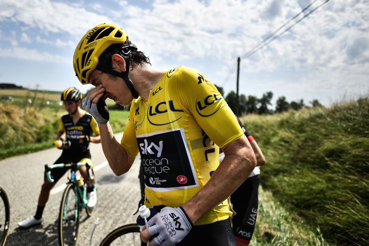 Great Britain's Geraint Thomas cleans his eyes after tear gas was used during a farmers' protest who attempted to block the stage's route, during the 16th stage of the 105th edition of the Tour de France cycling race, between Carcassonne and Bagneres-de-L