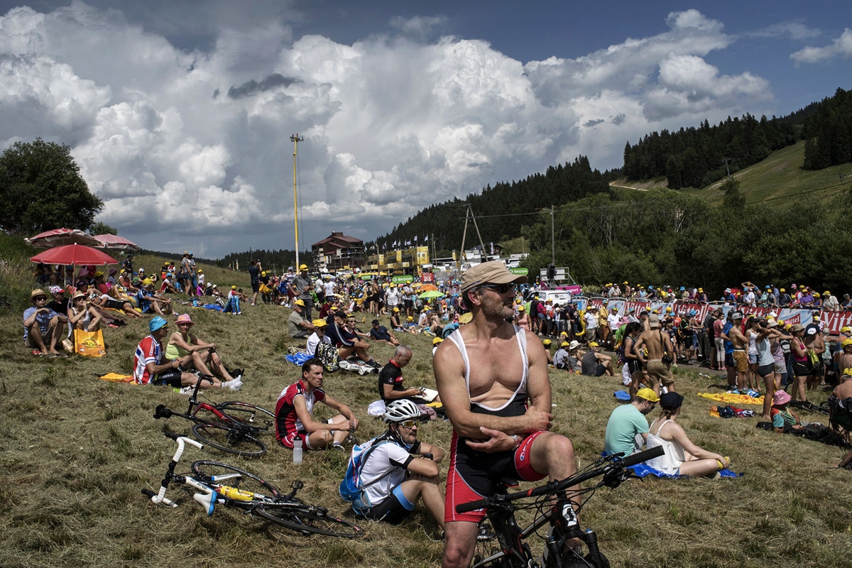 Supporters wait for riders near the finish line during the 187,5 km eighth stage of the 104th edition of the Tour de France cycling race on July 8, 2017 between Dole and Station des Rousses.