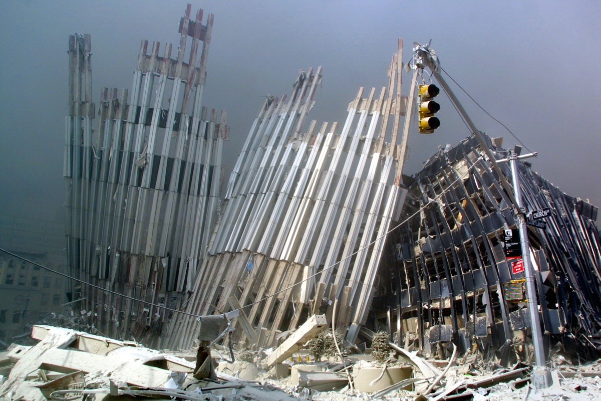 A part of a tower can be seen after the collapse of the first World Trade Center Tower 11 September, 2001 in New York.