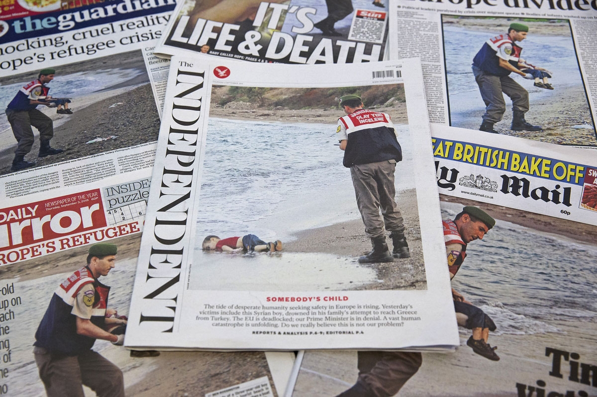 The front pages of some of Britain's daily newspapers showing an image of the body of Syrian three-year-old boy Aylan are pictured in London, on September 3, 2015. Th