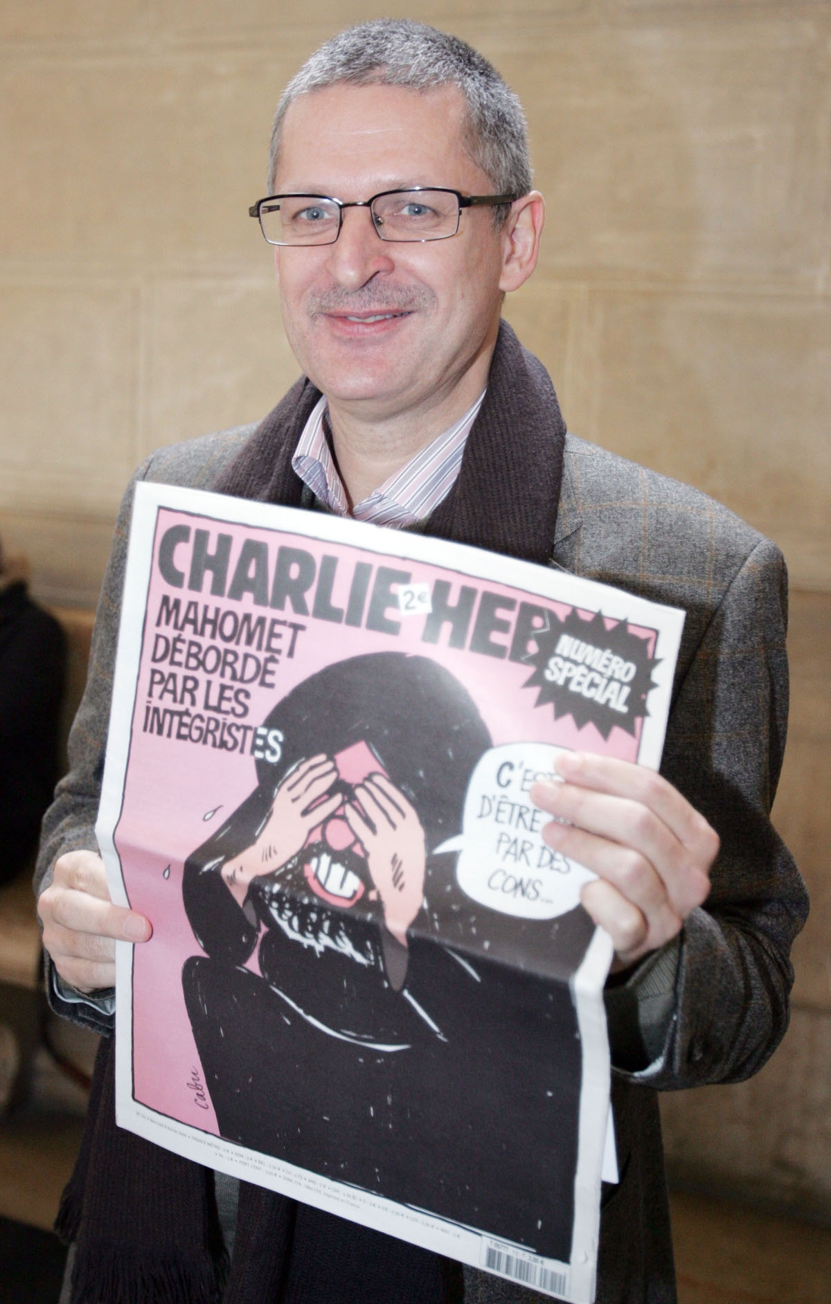 Culture editor of the Danish newspaper Jyllands-Posten, Fleming Rose shows French satirical weekly Charlie Hebdo 07 February 2007 at the Paris court to attend the trial of French satirical weekly Charlie Hebdo chief editor Philippe Val trial on the case b