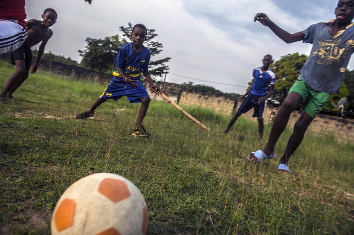 Gabonese boys play a football match in Franceville on January 17, 2017, as the Africa Cup of Nations tournament takes place in Gabon.