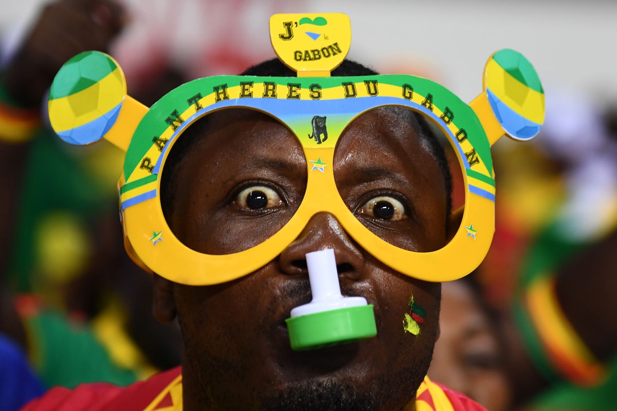 A Gabon supporter blows a whistle ahead of the 2017 Africa Cup of Nations group A football match between Cameroon and Guinea-Bissau at the Stade de l'Amitie Sino-Gabonaise in Libreville on January 18, 20