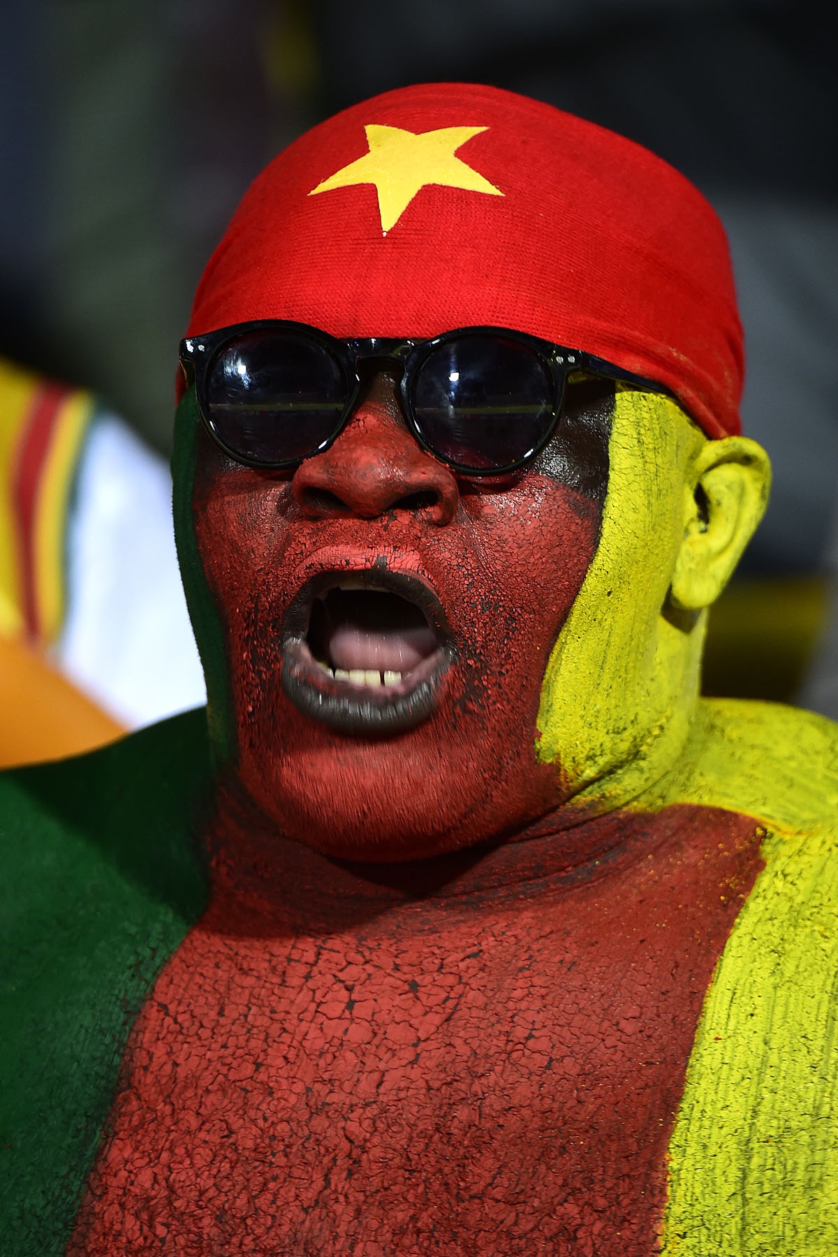 A Cameroon supporter cheers ahead of the 2017 Africa Cup of Nations quarter-final football match between Senegal and Cameroon in Franceville on January 28, 2017.