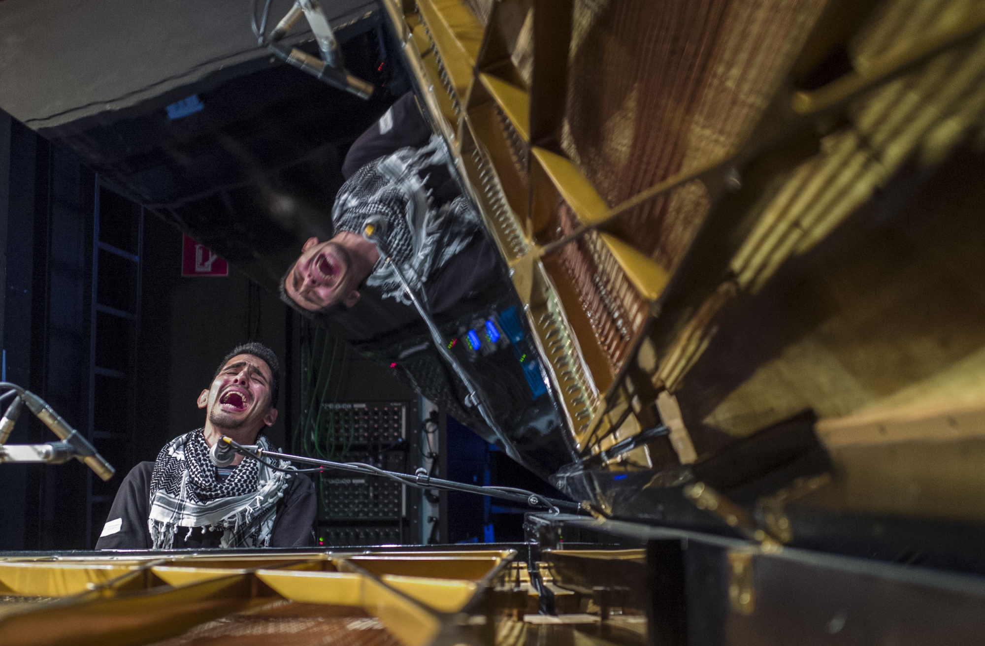 Palestinian/Syrian refugee Ayham Ahmad, also known as the pianist of Yarmouk performs during a sound check, prior to a concert at Berlin's Heimathafen concert hall on May 12, 2016 Palestinian/Syrian refugee Ayham Ahmad, also known as the pianist of Yarmouk performs during a sound check, prior to a concert at Berlin's Heimathafen concert hall on May 12, 2016