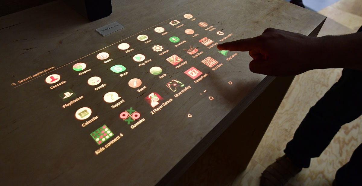 A fair worker presents the Xperia Touch at the booth of Sony at the IFA Consumer Electronics Fair in Berlin in Berlin on August 31, 2017. The fair is open for the public from September 1 to 6, 2017.