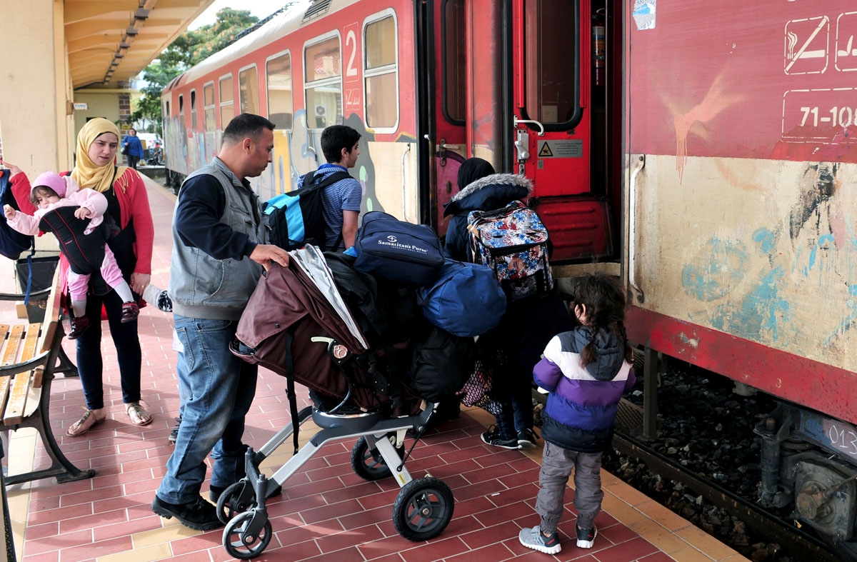 Adan's family members from the Syrian city of Aleppo board on a train at the railway station of Alexandroupoli some 300 km North-East from Thessaloniki, near the Greek-Turkish border, on October 26, 2016.