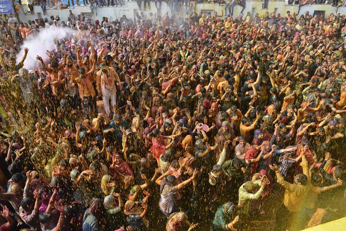 Indian Hindu devotees celebrate Holi, the spring festival of colours, in Mathura in Uttar Pradesh state on March 12, 2017.