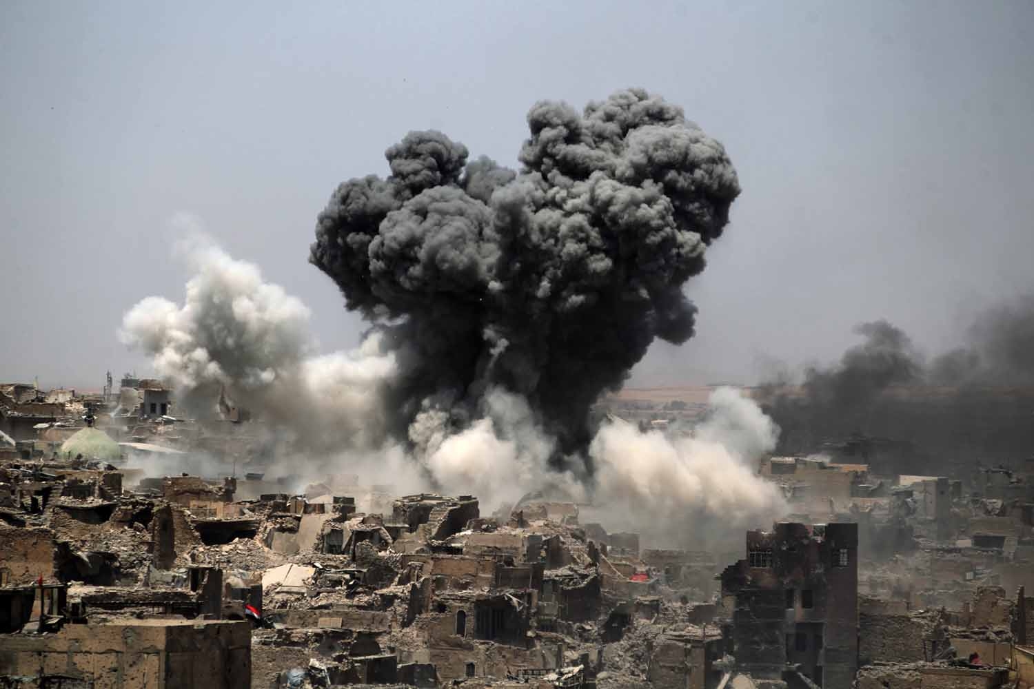 A picture taken on July 9, 2017, shows smoke billowing following an airstrike by US-led international coalition forces targeting Islamic State (IS) group in Mosul.