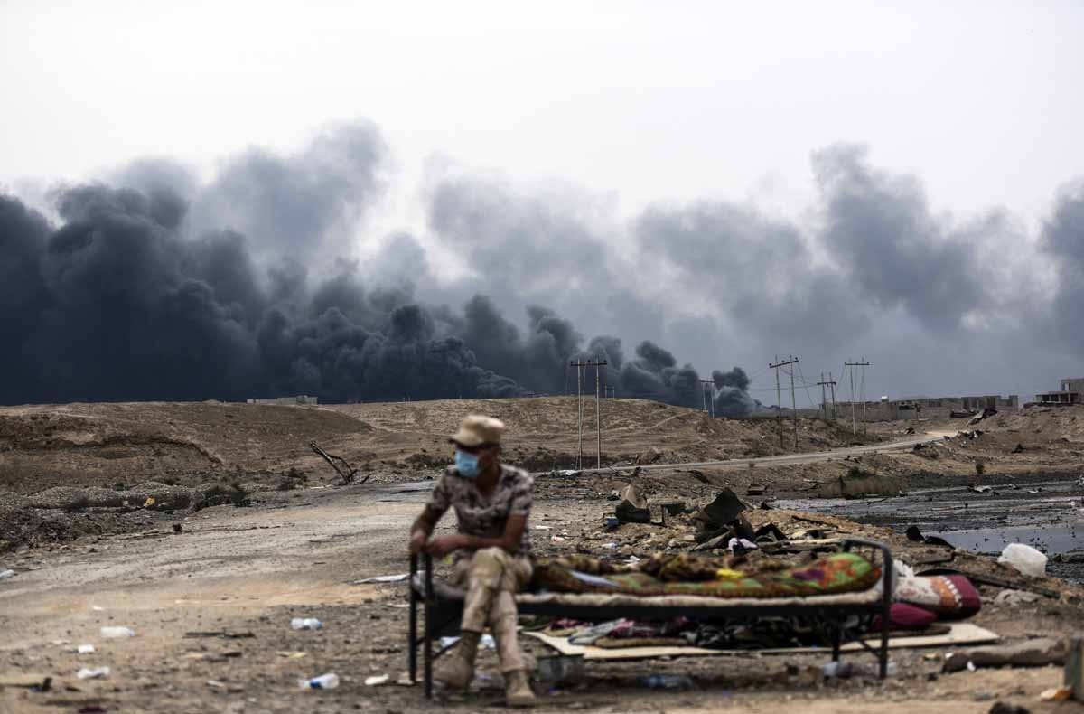 An Iraqi soldier sits at a checkpoint in an area near Qayyarah on October 28, 2016, as he waits for families who were displaced by the ongoing operation by Iraqi forces against jihadists of the Islamic State group to retake the city of Mosul. An Iraqi soldier sits at a checkpoint in an area near Qayyarah on October 28, 2016, as he waits for families who were displaced by the ongoing operation by Iraqi forces against jihadists of the Islamic State group to retake the city of Mosul.