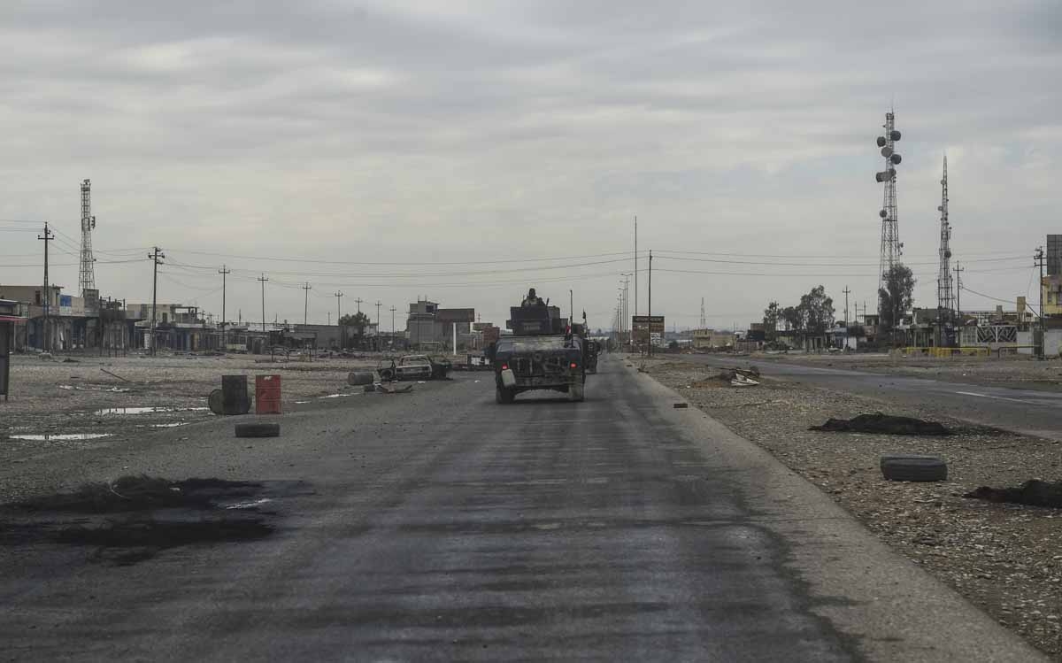 Iraqi army vehicles drive through the village of Gogjali, a few hundred metres of Mosul's eastern edge, on November 2, 2016, as they head towards the city during the ongoing operation to retake it from Islamic State group jihadists. Iraqi army vehicles drive through the village of Gogjali, a few hundred metres of Mosul's eastern edge, on November 2, 2016, as they head towards the city during the ongoing operation to retake it from Islamic State group jihadists.