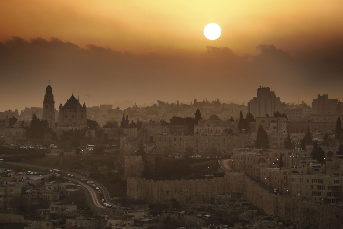 A partial view of the Old City of Jerusalem during sunset, on February 22, 2014. On the left the Christian Abbey of the Dormition.