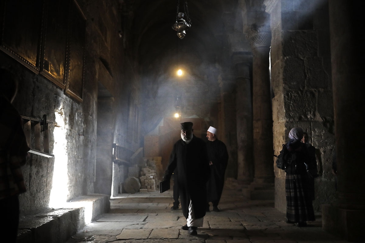An Ethiopian priest walks inside the Holy Sepulchre church, one of the holiest place for Christians, in the Old City of Jerusalem, on February 9, 2018.